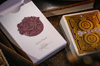 a box of playing cards next to a box of books